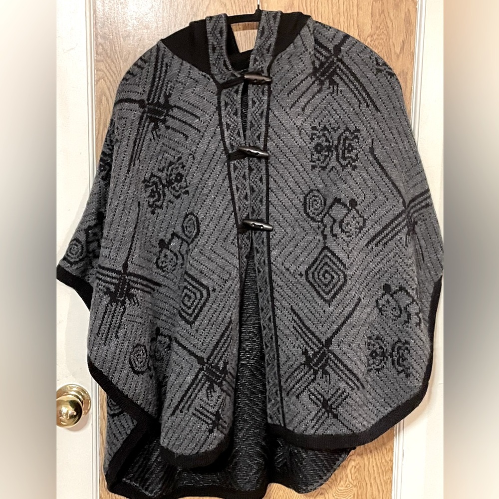 Poncho, cape, sarape.